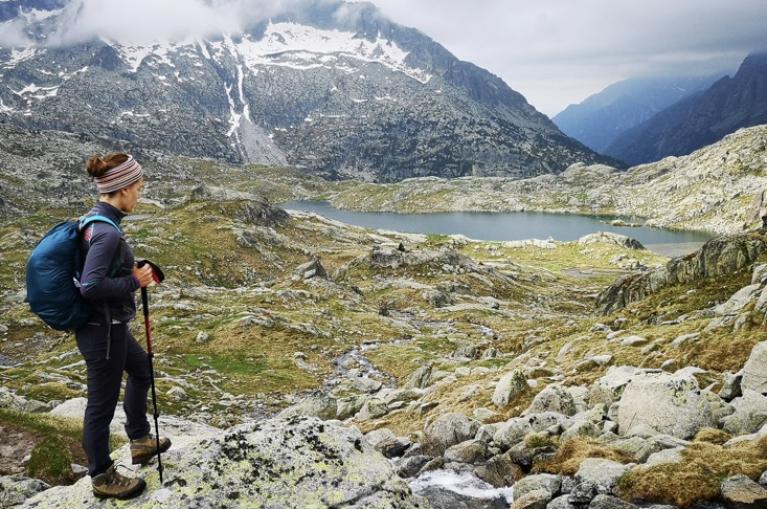 Hiker around lakes in Aigües Tortes