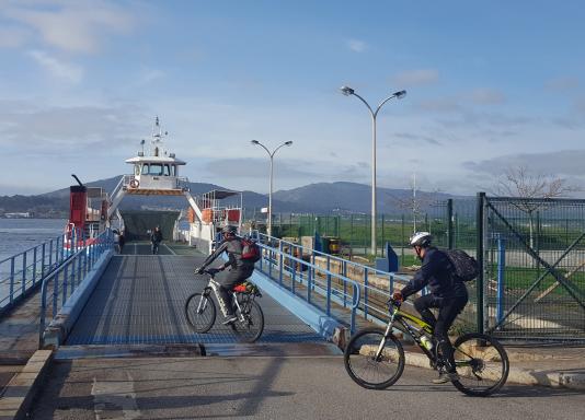 Cyclists taking ferry in Caminha
